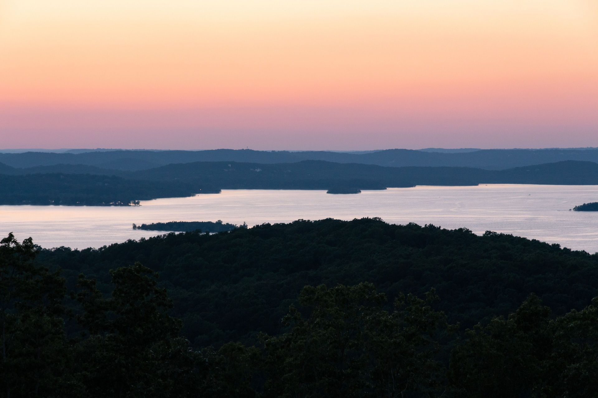 Sunset over Table Rock Lake and the forested Ozark hills near Branson, Missouri